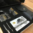 Lokko box opened, Showing 2 clear locks, wallet, sets of keys and credit card spy kit